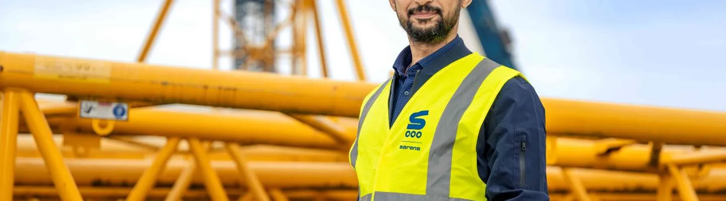 Sarens employee standing outdoors at the company site