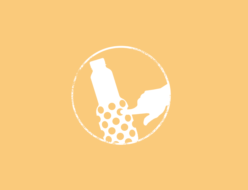 A white silhouette of a hand reaching for a granini bottle with polka dots inside a circle on a light orange background.