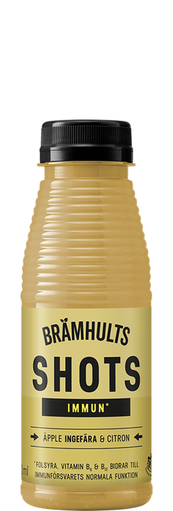 A bottle of Brämhults Immun Shots, featuring apple, ginger, and lemon. Yellow label with a black cap. Contains vitamin B and folate.