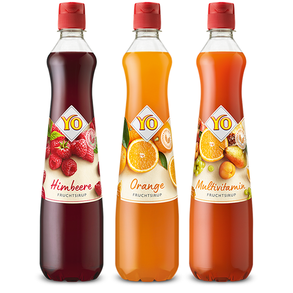 Three bottles of fruit syrup: raspberry, orange, and multivitamin flavors, each with colorful labels and red caps.