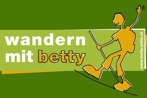 Logo for "wandern mit betty" (hiking with betty) with an orange stick figure hiker, backpack, and poles on a green background. www.betty-jehle.at