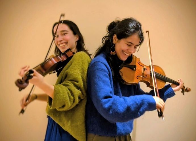 2 musicians playing a musical instrument of their choice