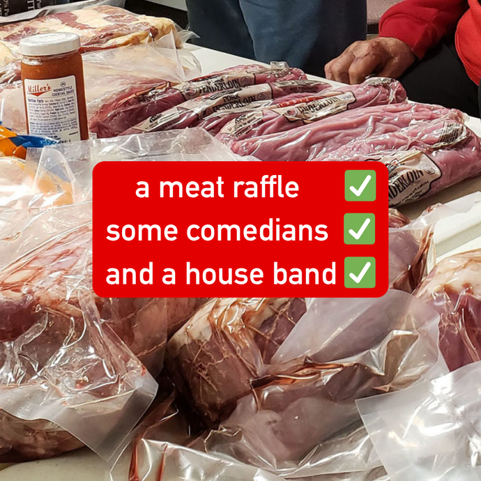 Sealed packages of raw meat are laid out on a table, with various cuts visible and people standing nearby in an indoor setting.