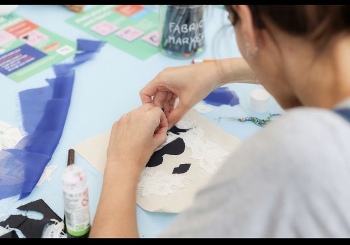 close up over someone's shoulder as they create artwork