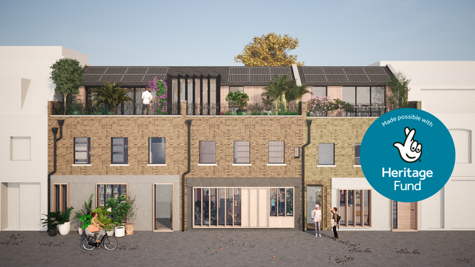 Modern brick building with rooftop garden and solar panels, people walking, and a "Heritage Fund" logo on the right side.
