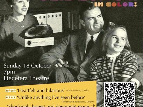 Two adults and a child sit together, one adult holding a box with a round slide tray, with colourful text reading 'SLIDESHOW IN COLOR!' above them.