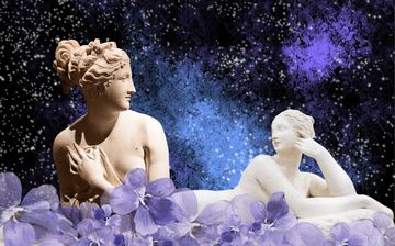 Two classical sculptures with floral decorations, set against a cosmic background of stars and purple hues.