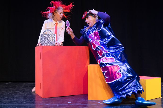 2 actors on stage in costume