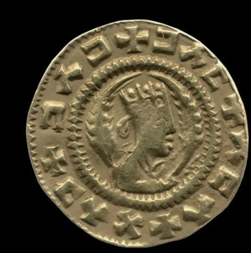 Ancient coin featuring a profile of a crowned figure, surrounded by inscriptions, on a dark background.