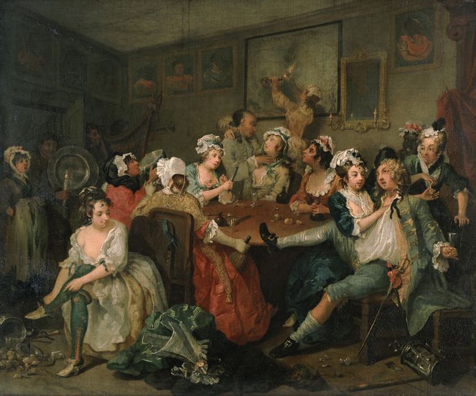 A lively, chaotic scene of people in 18th-century attire gathered around a table, drinking and socializing in a dimly lit room.