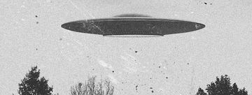 A vintage-style black and white photo depicts a flying saucer hovering above treetops.