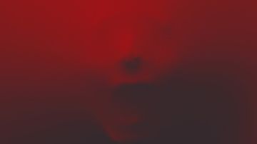 A face pressing against a translucent red surface, creating a distorted and eerie appearance.