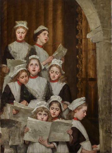 A group of young girls in uniform, holding sheets of music, sing together in a choir, standing under an archway.