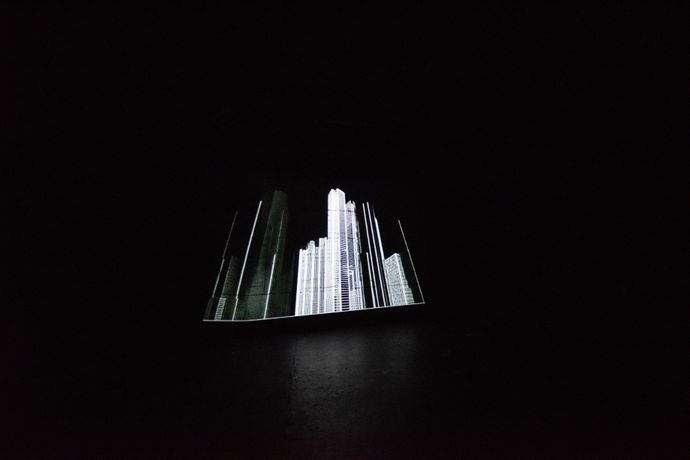 Black and white image of an illuminated city skyline