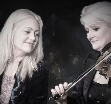 Two adults seated together, with one playing a violin while the other looks on.