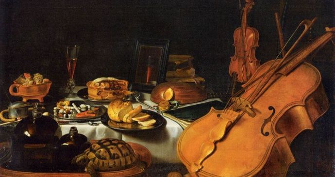 Still life painting with a viola da gamba, violin, food, and wine on a table. Includes bread, fruit, nuts, and a tortoise, set against a dark background.