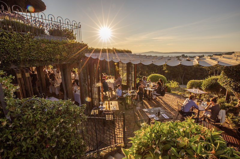 couple sitting at tables outside at Mudbrick Vineyard