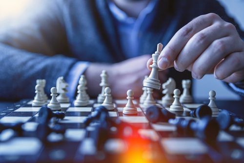 Man playing chess - game based learning