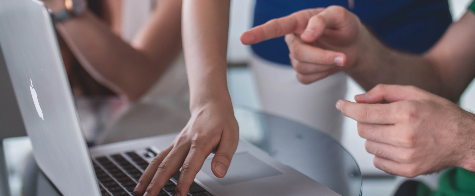 Players pointing at laptop screen