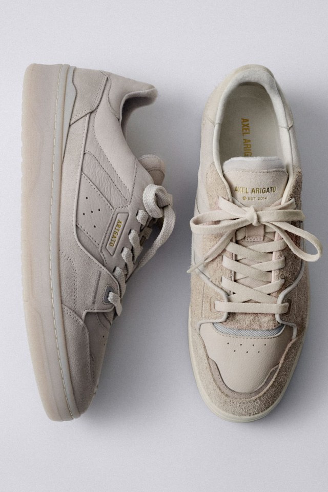 Beige sneakers displayed side by side on a light background; one shoe shown from above, the other from the side.