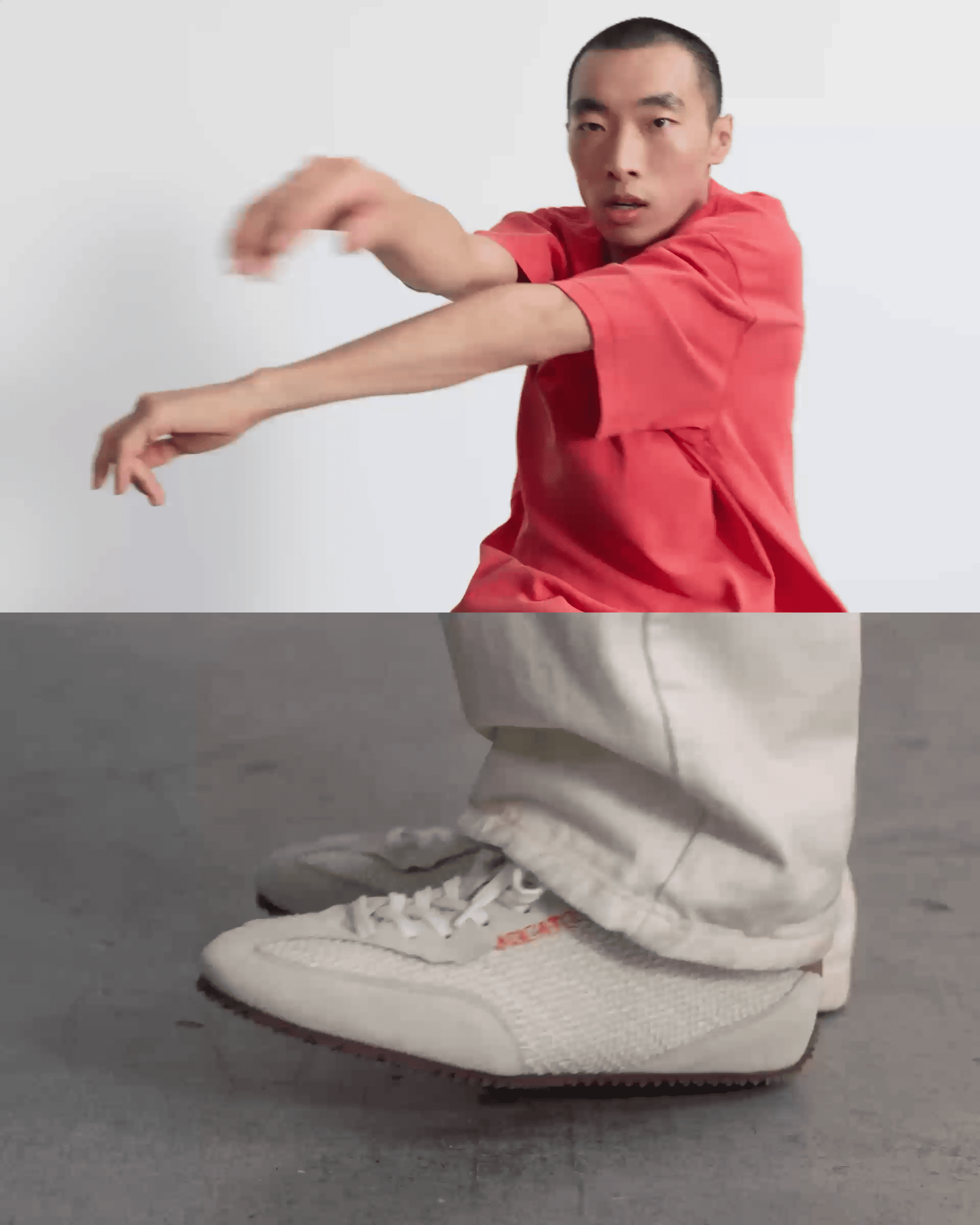 Person in a red shirt dancing energetically, with a focus on their white sneakers and light pants moving across a gray floor.