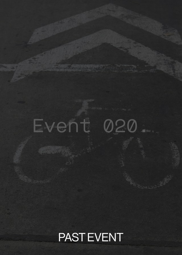 Faded bicycle path symbol on dark pavement marked with "Event 020" and "PAST EVENT" in white text.