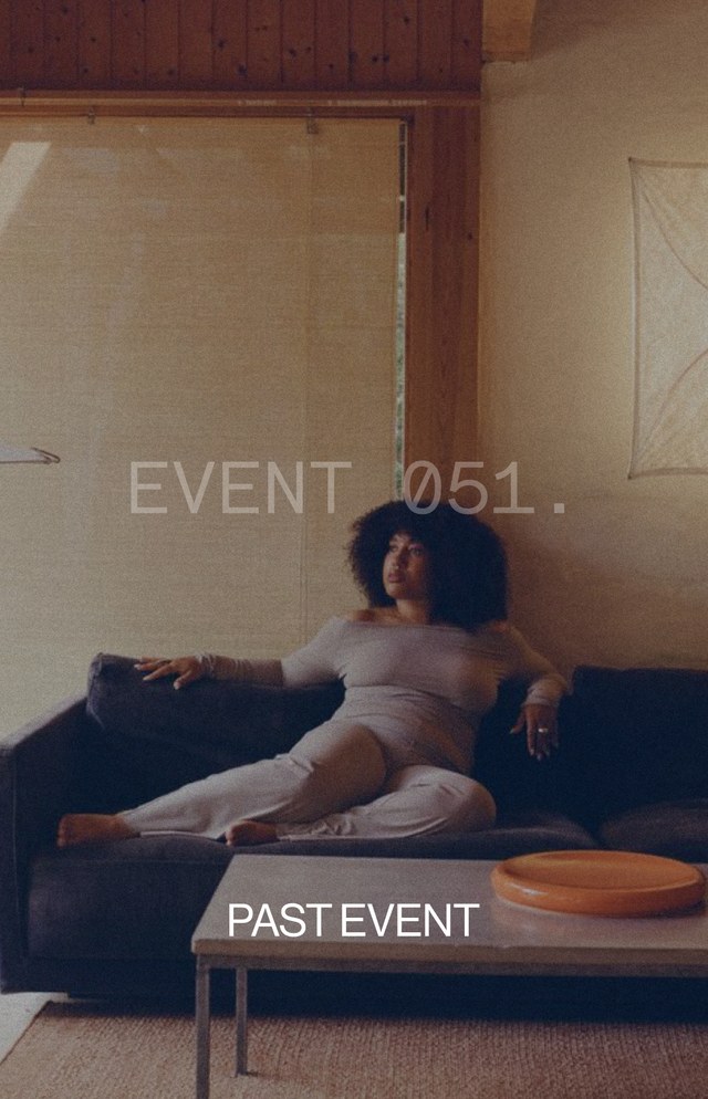 Person in a cozy living room sitting on a couch by a window, with text overlay reading "EVENT 051." and "PAST EVENT."
