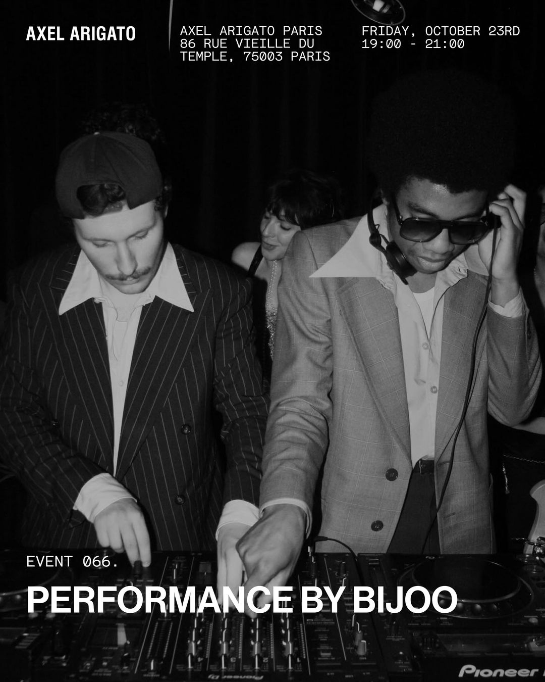 Two DJs performing at Axel Arigato in Paris, with one adjusting headphones and the other adjusting mixer controls. Event details displayed above.