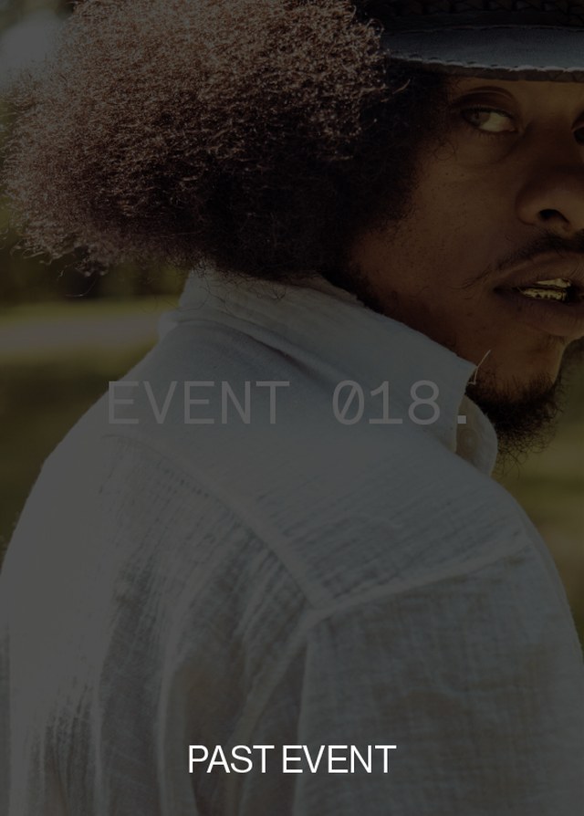 Person with curly hair wearing a hat and white shirt, looking over shoulder. Text overlaid: "EVENT 018." and "PAST EVENT."