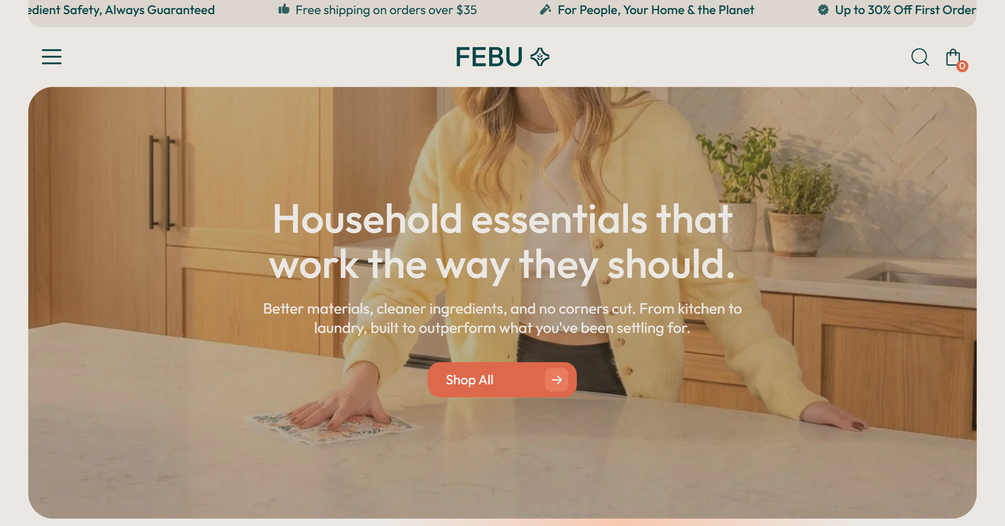 Woman in a kitchen wiping a marble countertop, promoting FEBU's household essentials with a "Shop All" button.