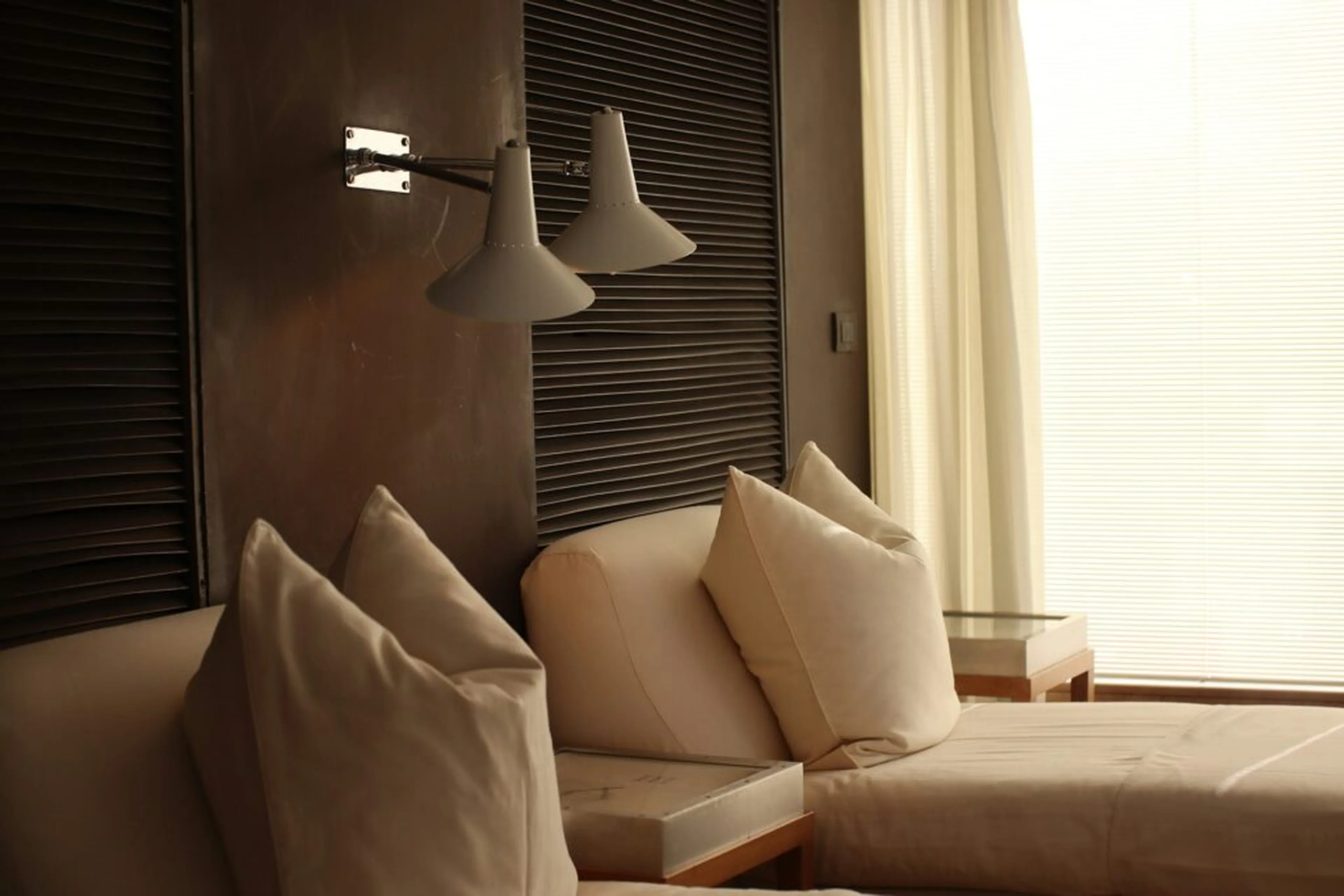 two single beds in a beige hotel room