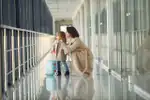 Woman and daughter at airport