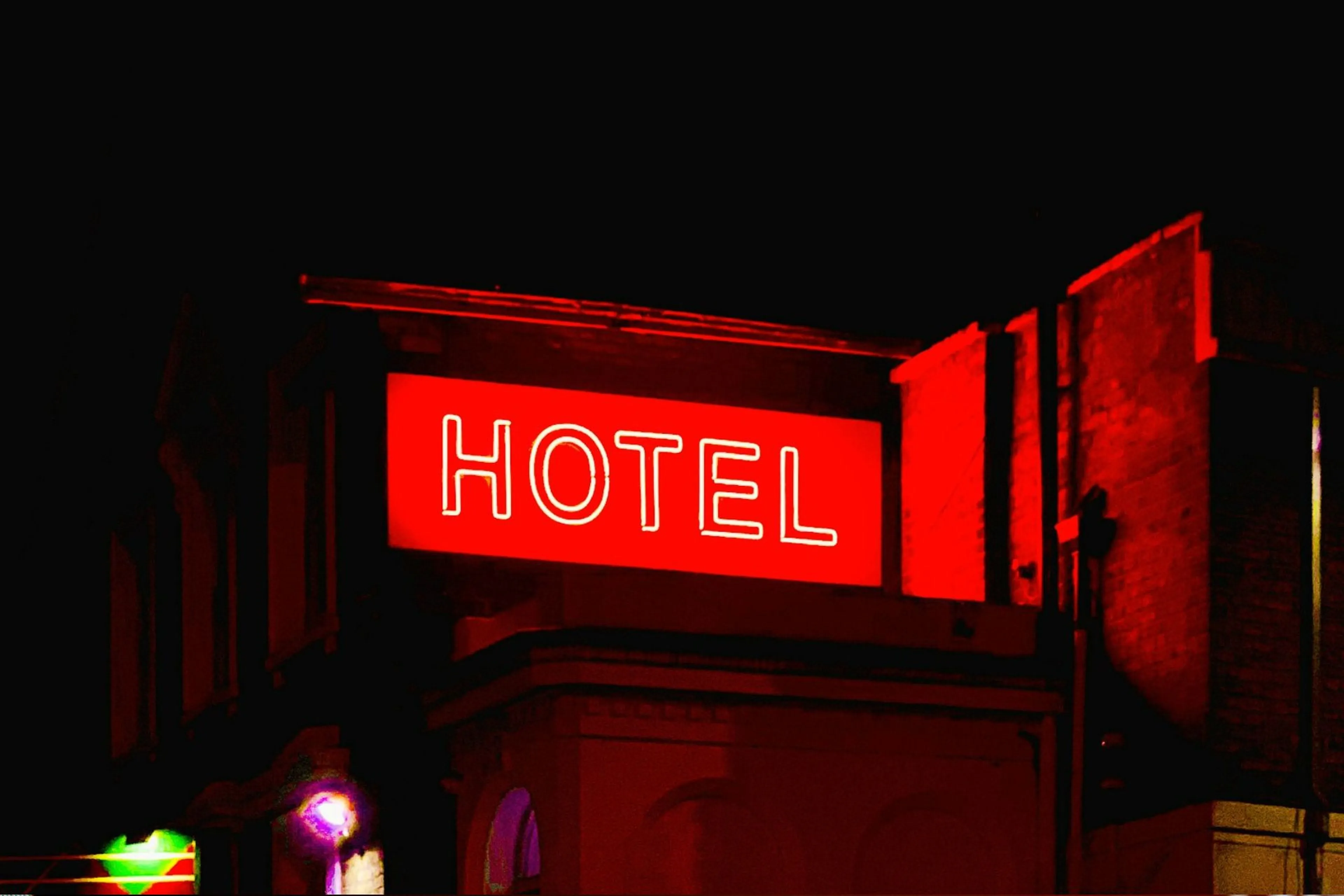 A neon red Hotel sign
