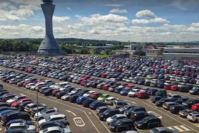 Edinburgh Airport Terminal Surface car park with control tower in background