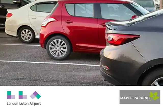 Grey, red and white cars in staggered bays photographed from the side with Luton Airport and Maple Parking logo