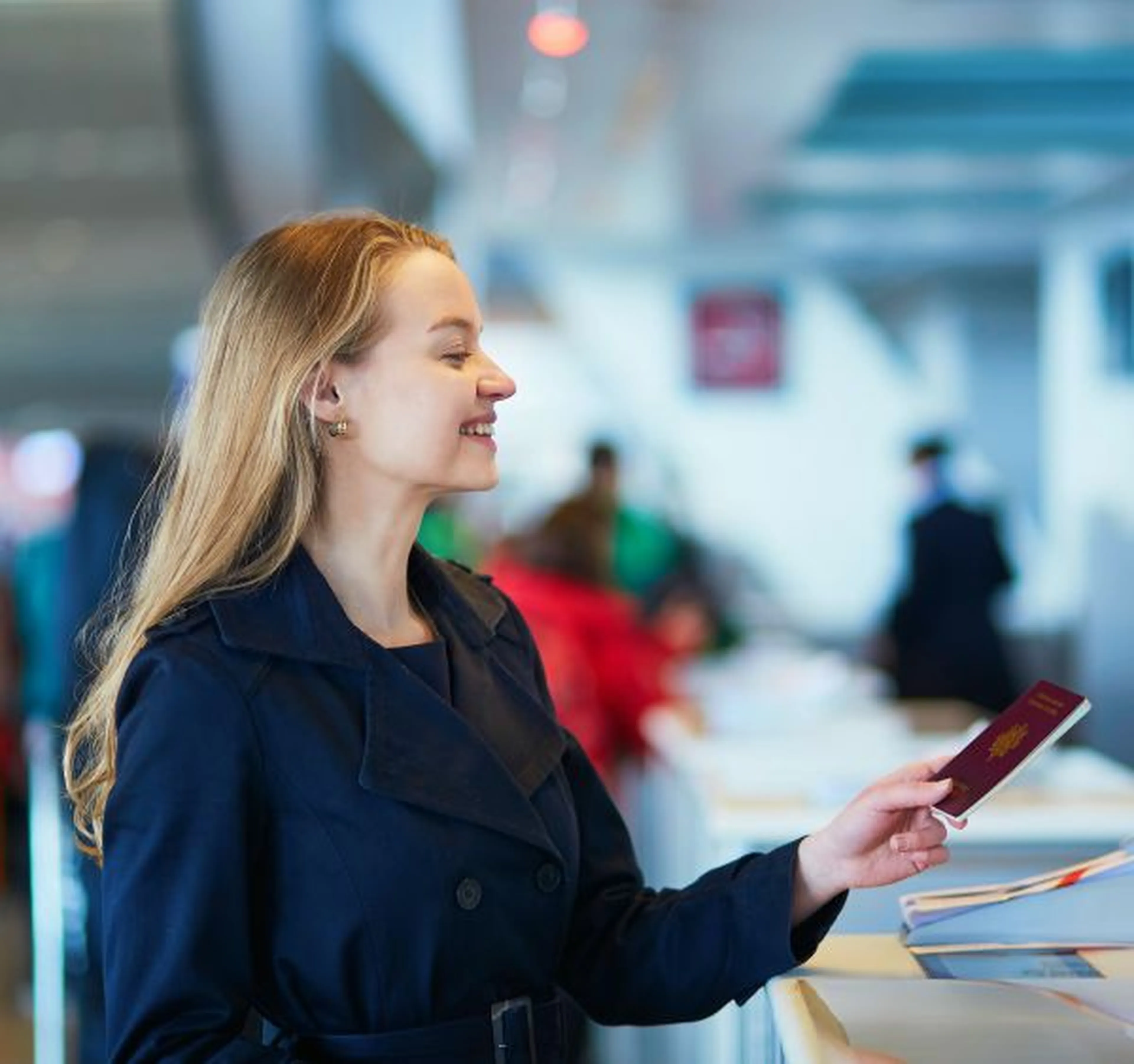 Woman at the airport with her passport