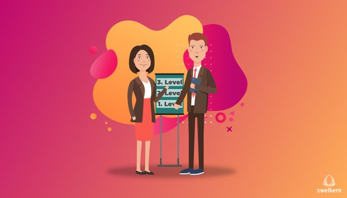 Two people standing in front of a flipchart