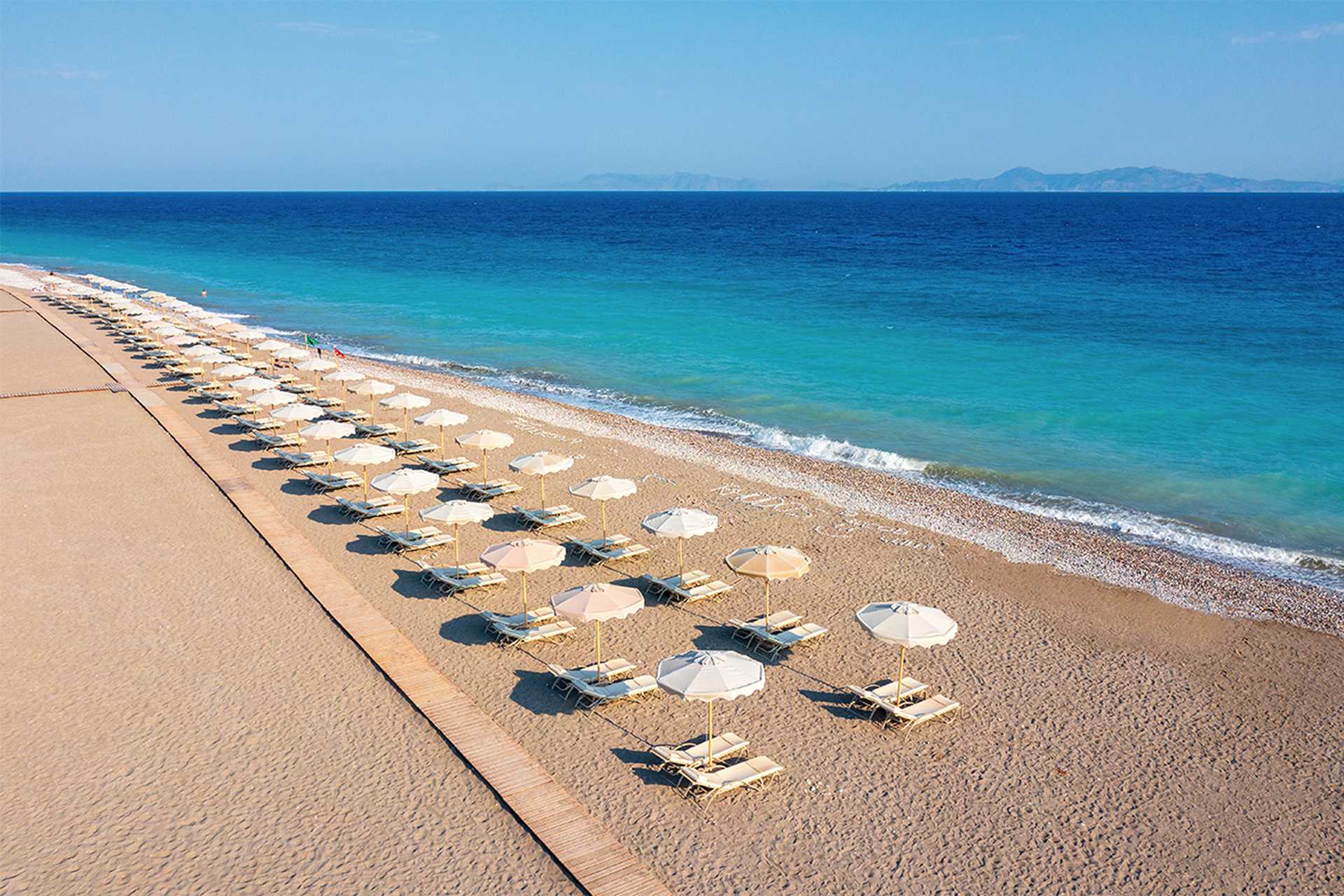 Relax on the hotel’s private beach - Sun Beach Resort, Ialyssos, Rhodes, Greece