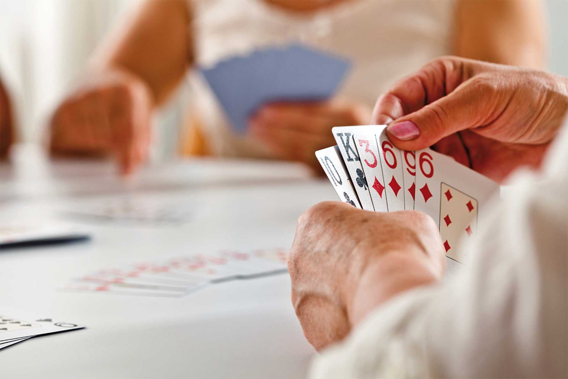 Bridge, Focus on senior woman's hand holding cards
