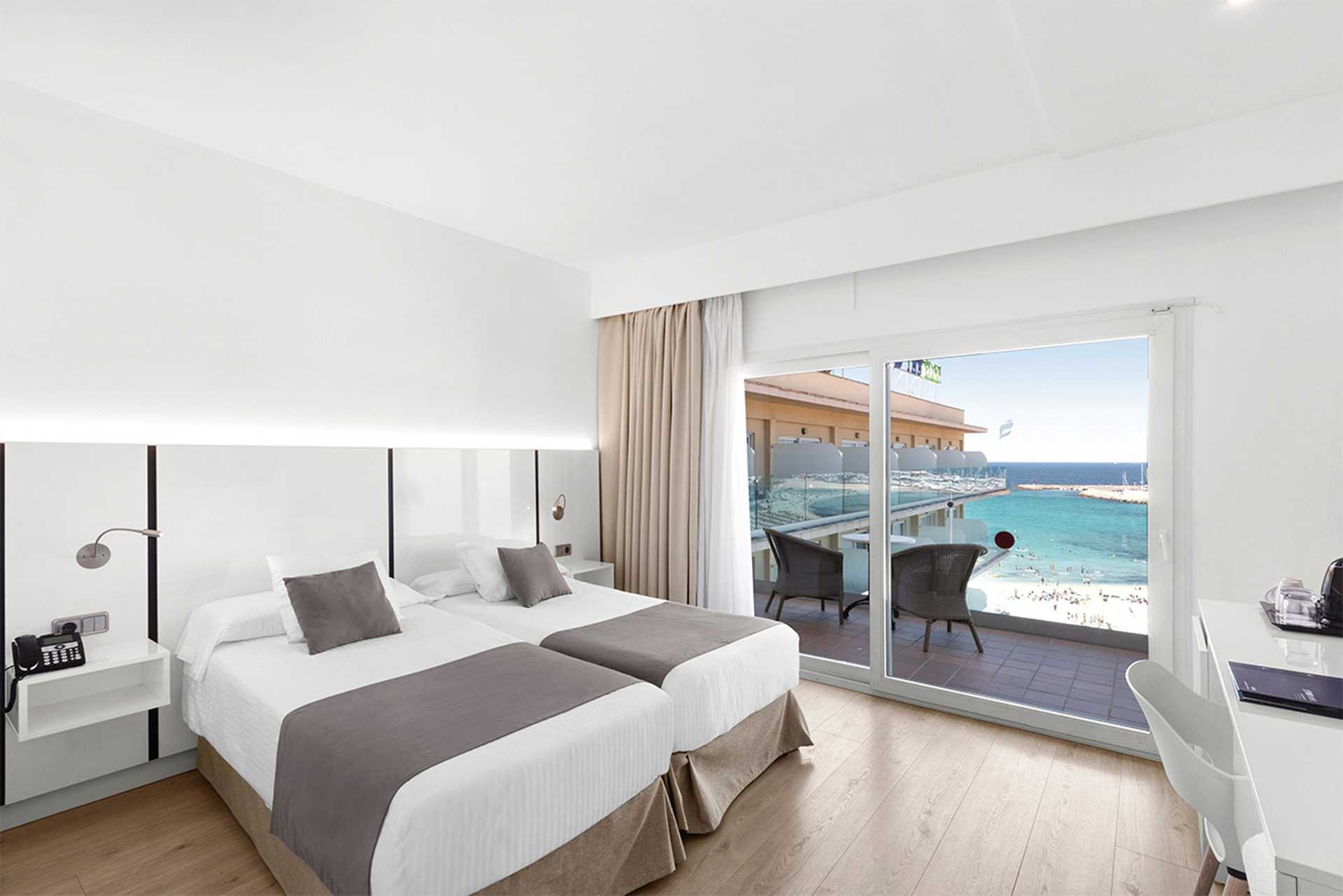 A twin room with a side-sea view