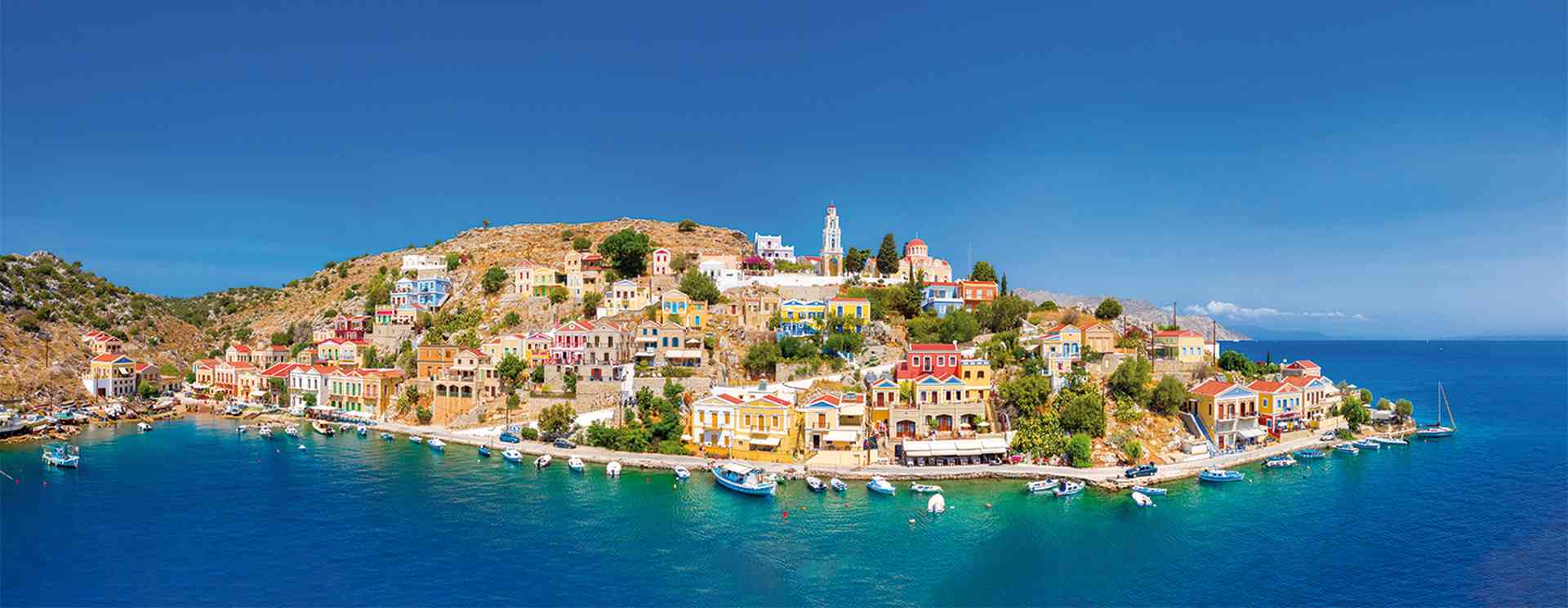 Colorful houses village in Symi island, Dodecanese islands, Greece.