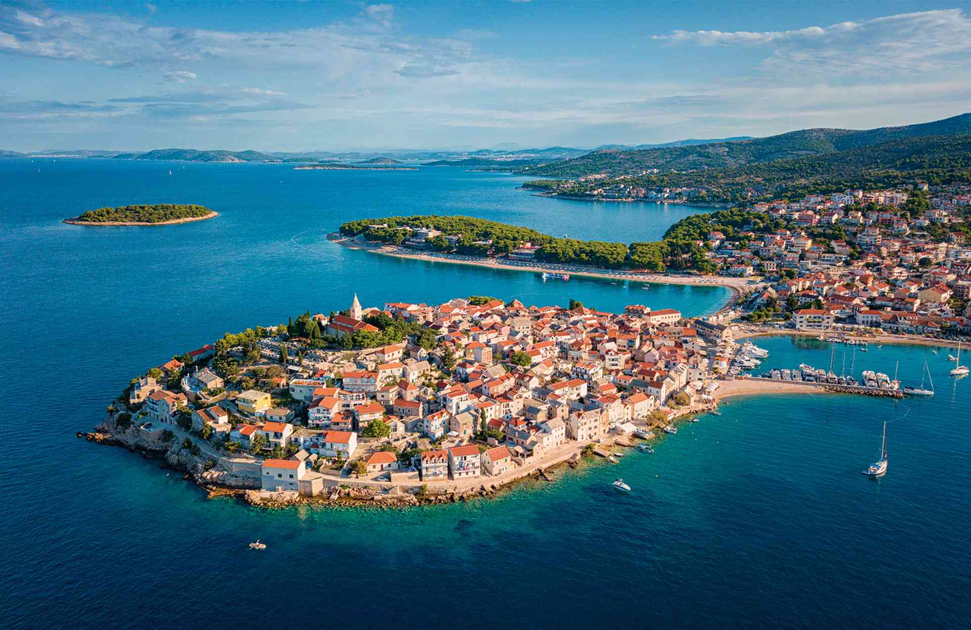 Aerial view of Primosten old town on the islet, amazing sunny landscape, Dalmatia, Croatia.