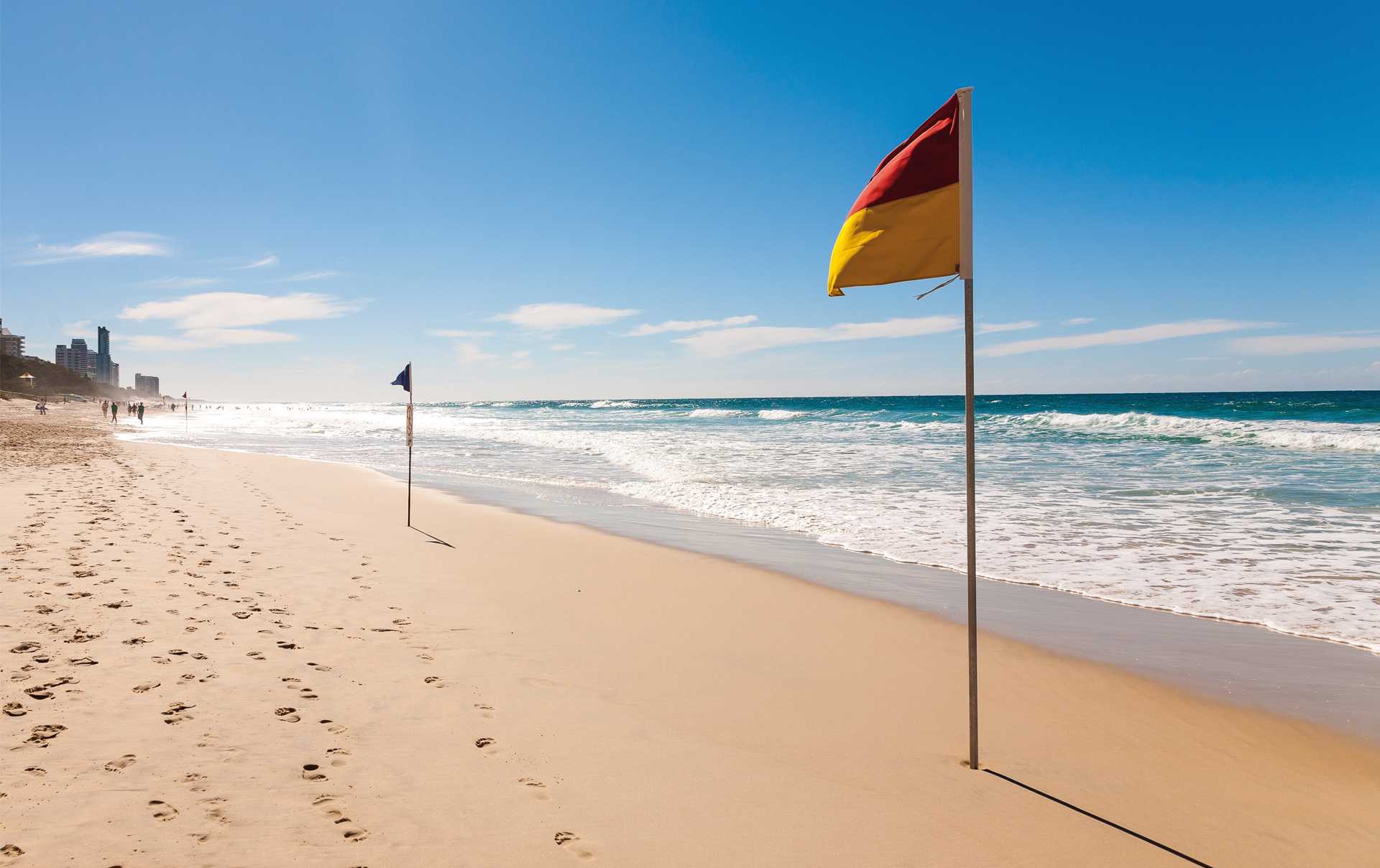 Red and yellow flags on the beach indicate that a lifesaving service is operating and that it's safe to swim between the flags.