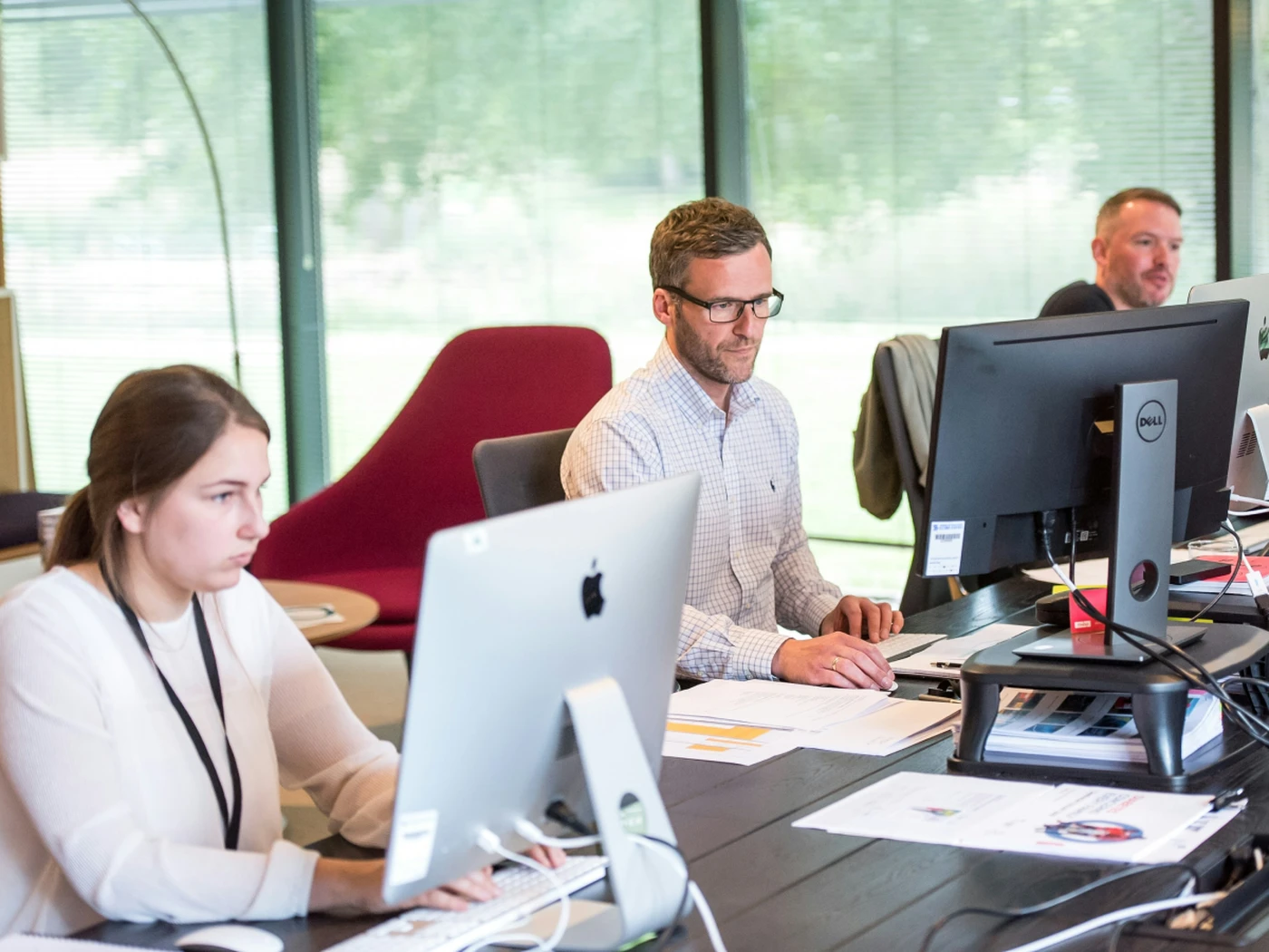 Multiple people working on their computer