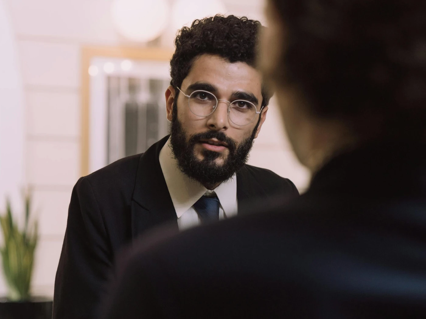 Receptionist talking to guest