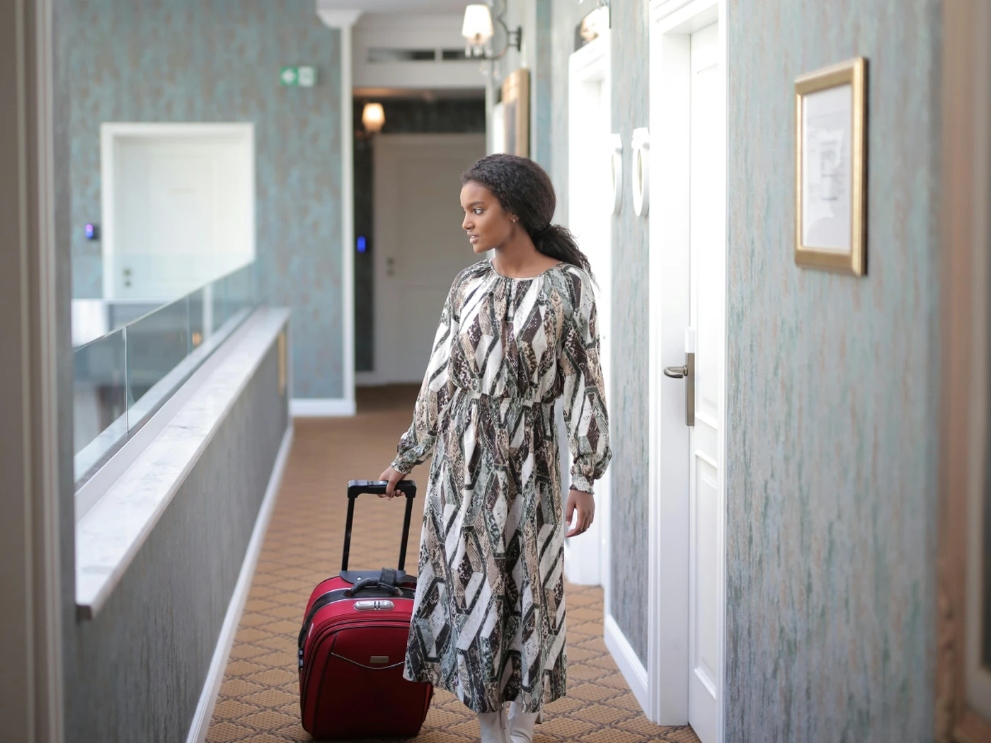traveler with suitcase arriving at hotel