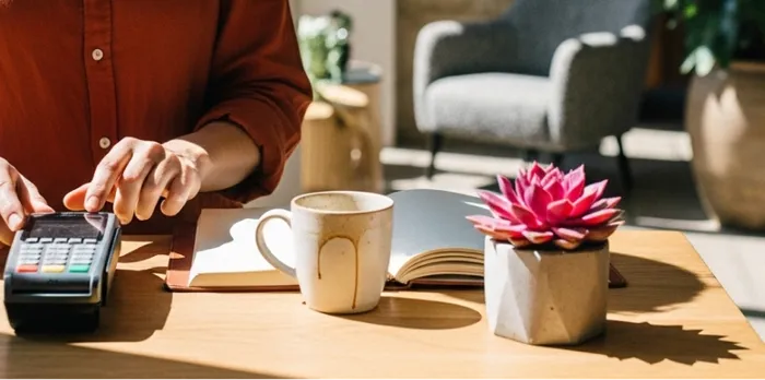 An independent hotelier processing payments at their hotel