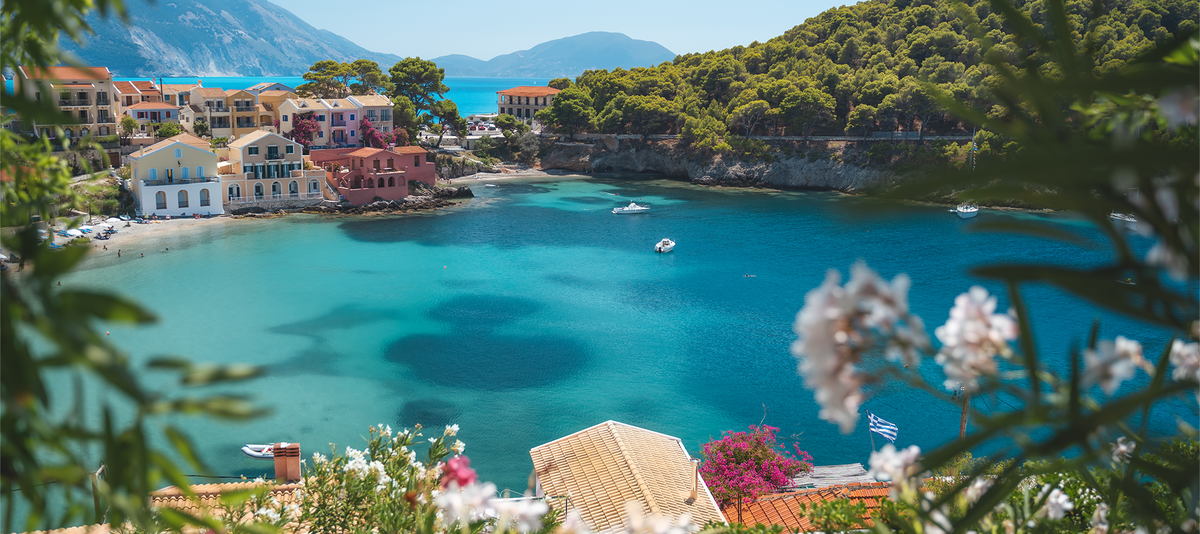 Scenic view of a Assos Town with colorful houses and turquoise water, Kefalonia, Greece