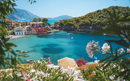 Scenic view of a Assos Town with colorful houses and turquoise water, Kefalonia, Greece