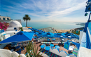 Panoramic view of seaside and cafe terrace in Sidi Bou Said at sunset. Tunisia, North Africa